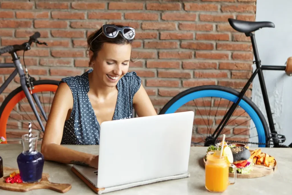 Woman working on a laptop under deadline pressure