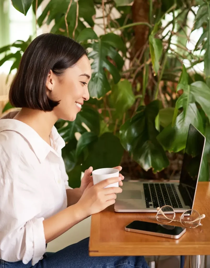 Professional working on a laptop, representing practical ADHD support at work and everyday workplace strategies.