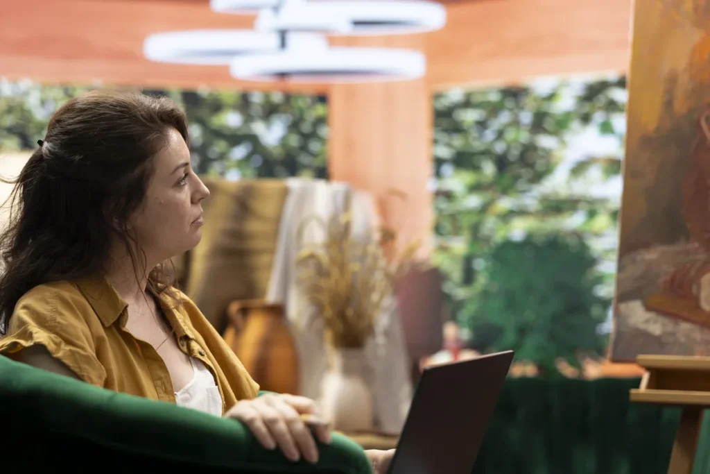 Woman reflecting at home, representing the experience of making decisions with ADHD.